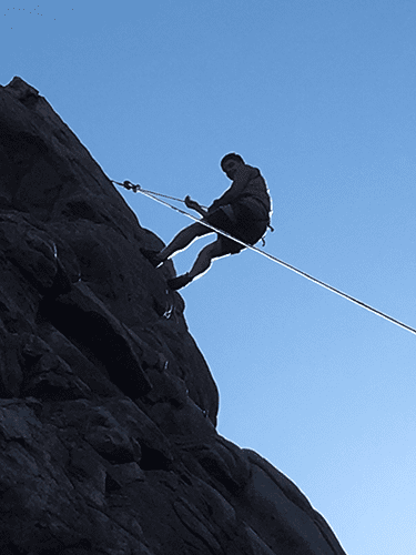 Grounds Member Rock Climbing