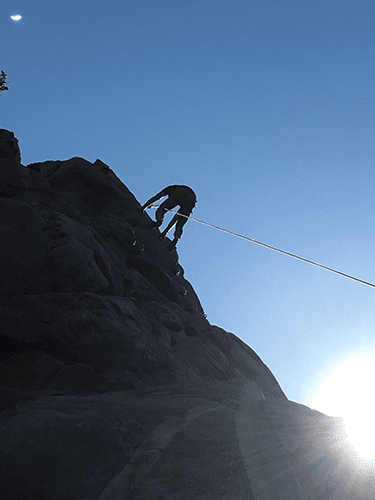 Topping out - rock climbing